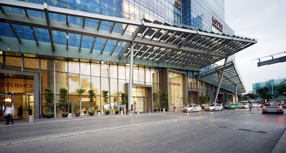 Lotte Center building with delicate design lines, reflecting sunlight